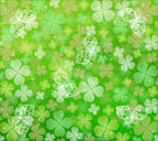 緑色背景の四つ葉のクローバーと蝶のスマートフォン壁紙